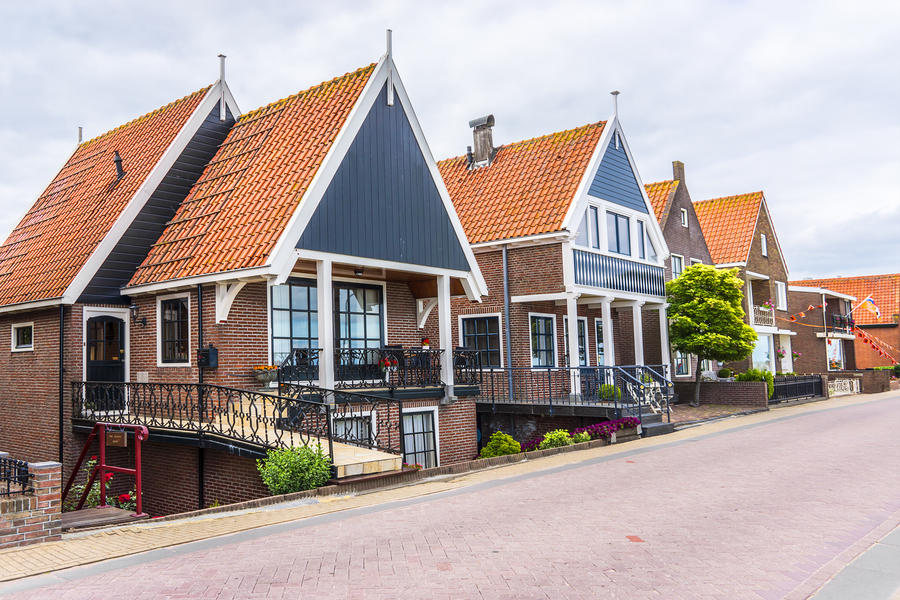 Beautiful traditional houses in a Dutch town Volendam, Netherlands. Volendam - a small town that has preserved the tradition of Dutch fishing villages.