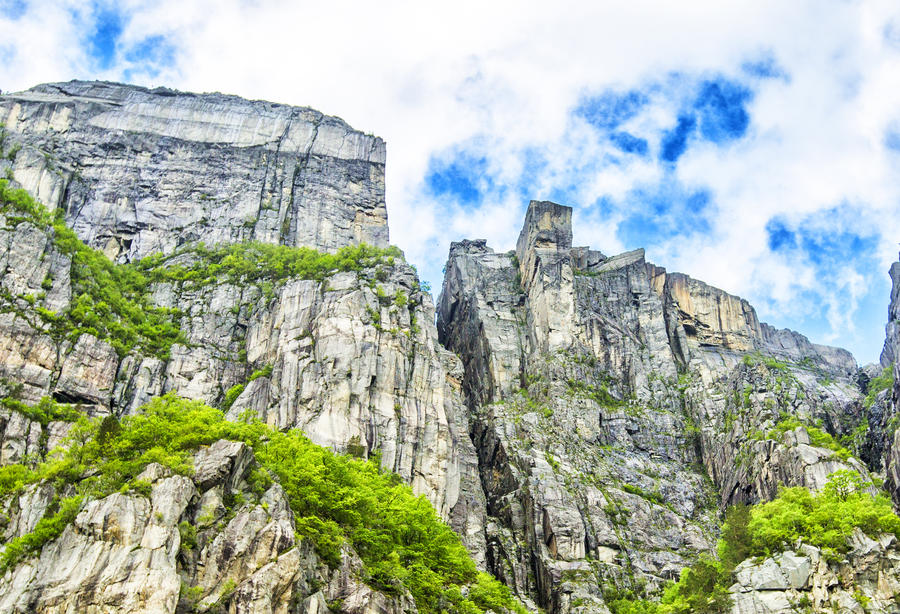 View up a gigantic rock in Lysefjord,  famous as Preikestolen - or pulpit rock, Norway.