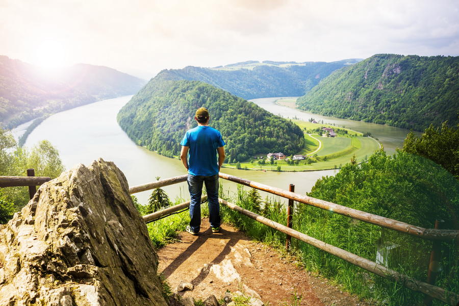 Man looking at Danube river. Austria.