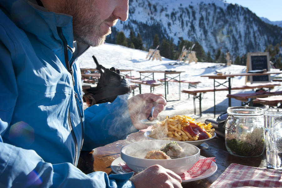 Lunch time - Man eating lunch at a mountain hut