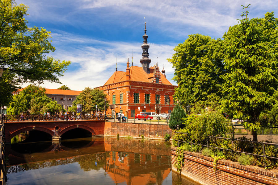 Beautiful scenery with renaissance building of Town Hall with reflection in water. Location place: Old Town, Gdansk, Poland.