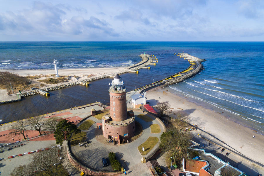 Lighthouse on the baltic seashore in a small resort town of Kolobrzeg in Poland, winter time