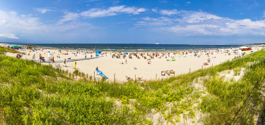 Panoramic view of crowded Baltic sea beach on Usedom island in Swinoujscie, Poland