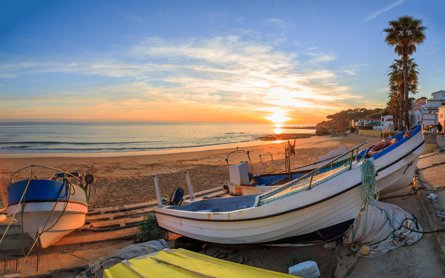 Boats in warm sunset light on the Fisherman's Beach (Praia dos Pescadores) in Albufeira, Portugal