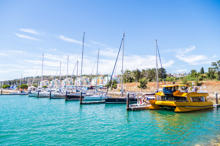 Vivid view of buildings and boats in the Porto de Abrigo de Albufeira, Albufeira Bay in Albufeira, Portugal