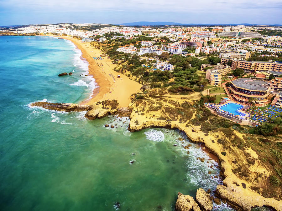 Algarve, Portugal: aerial UAV photo of rocks in the coast of Albufeira at sunrise