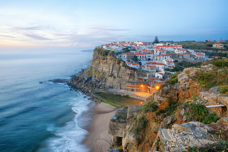 Azenhas do Mar village on a rock facing the atlantic ocean near Lisbon, Portugal at sunset