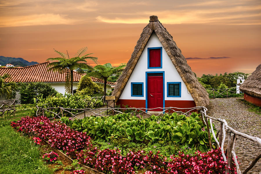 Traditional rural house in Santana Madeira, Portugal. Sunset view