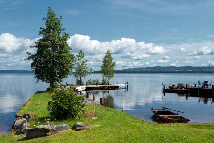 Quiet summer morning at Lake Siljan in the Swedish folklore district Dalecarlia. The lake is the largest impact crater in Europe caused by a meteorite more than 300 million years ago.