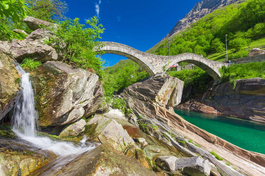 Double arch stone bridge at Ponte dei Salti with waterfall, Lavertezzo, Verzascatal, Canton Tessin.
