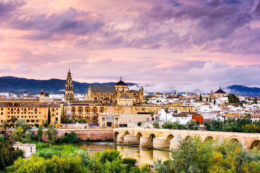 Cordoba, Spain at the Roman Bridge and Mosque-Cathedral on the Guadalquivir River.