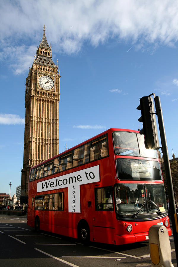 Big Ben - famous clock tower, the bigben, in City of Westminster, part of London with typical red double decker bus in foreground