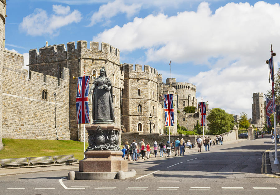 A view of Windsor Castle and Queen Victoria Statue in Windsor, England