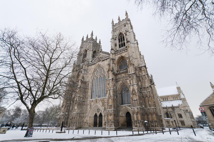 York Minster on a cold winter morning, with snow on the ground. Viewed from the western front.