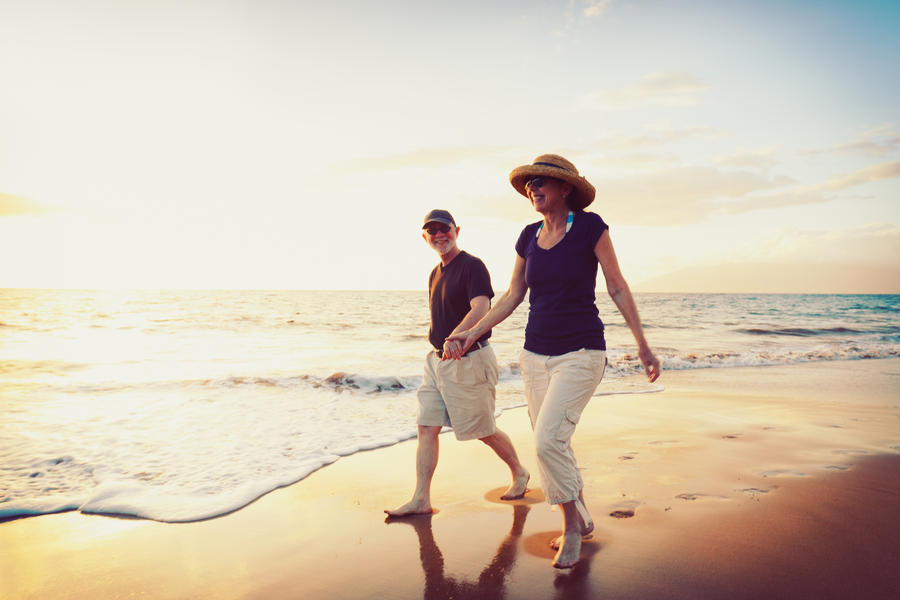 Senior Couple Enjoying Sunset at the Beach