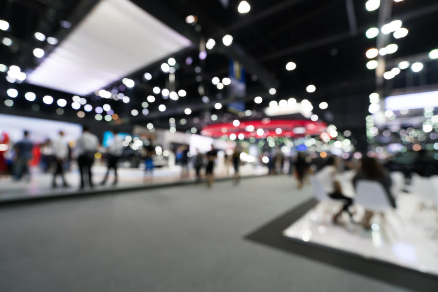 Blurred, defocused background of public event exhibition hall, business trade show concept