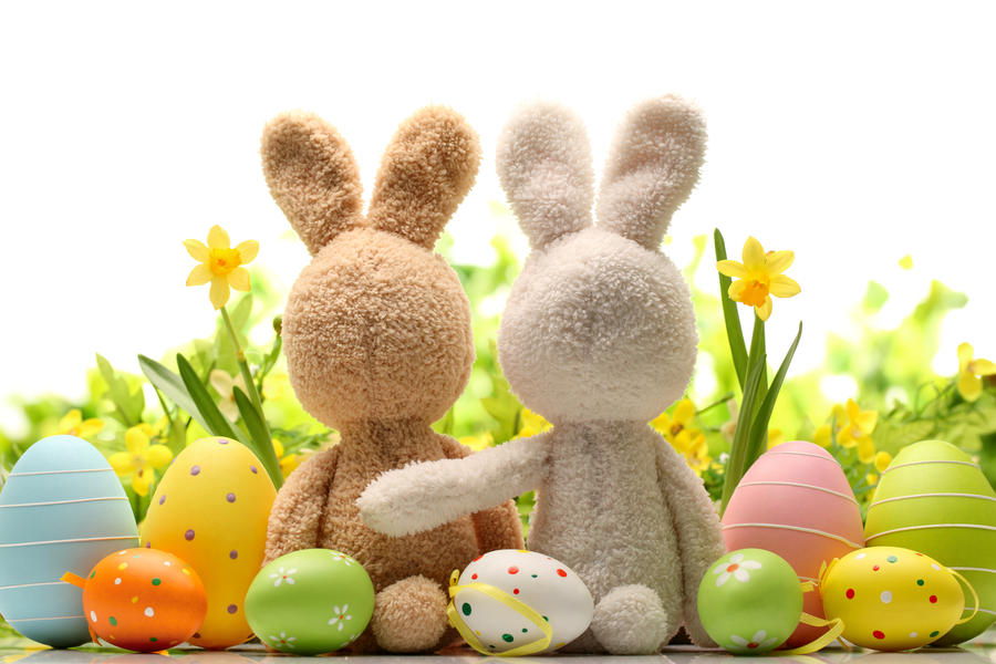 Easter decoration with sugar rabbits,eggs and flowers.