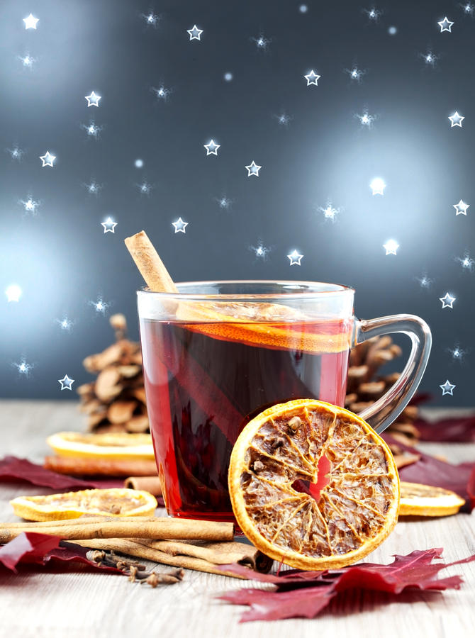 a glass of grog with decorated background