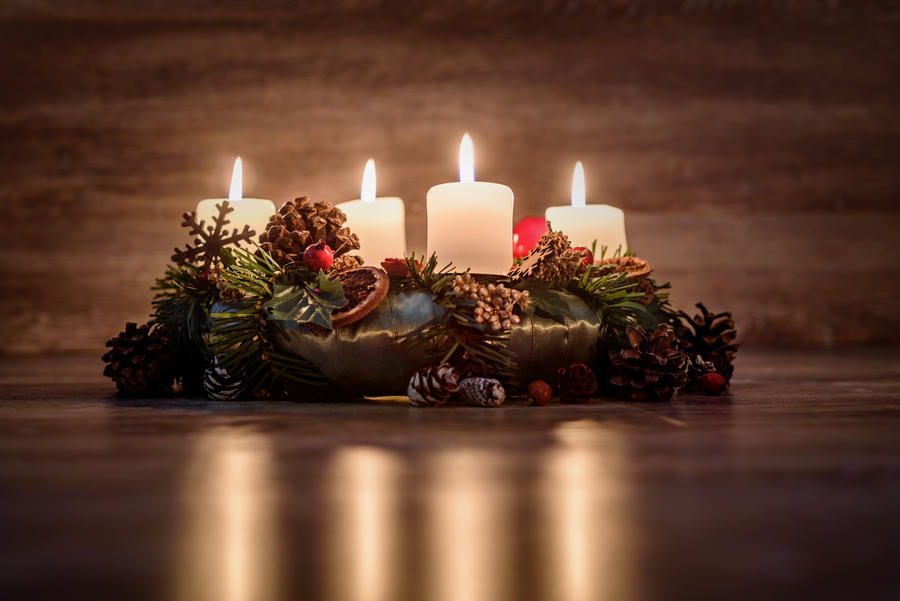 Advent wreath with burning candles for the Christmas time