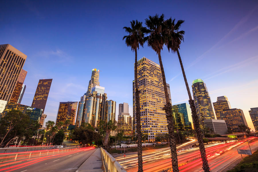 Downtown Los Angeles skyline during rush hour at sunset