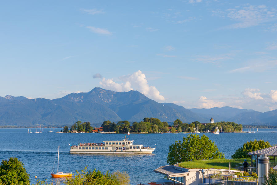 Ferry at Lake Chiemsee with Island Fraueninsel in Bavaria on a sunny summer day
