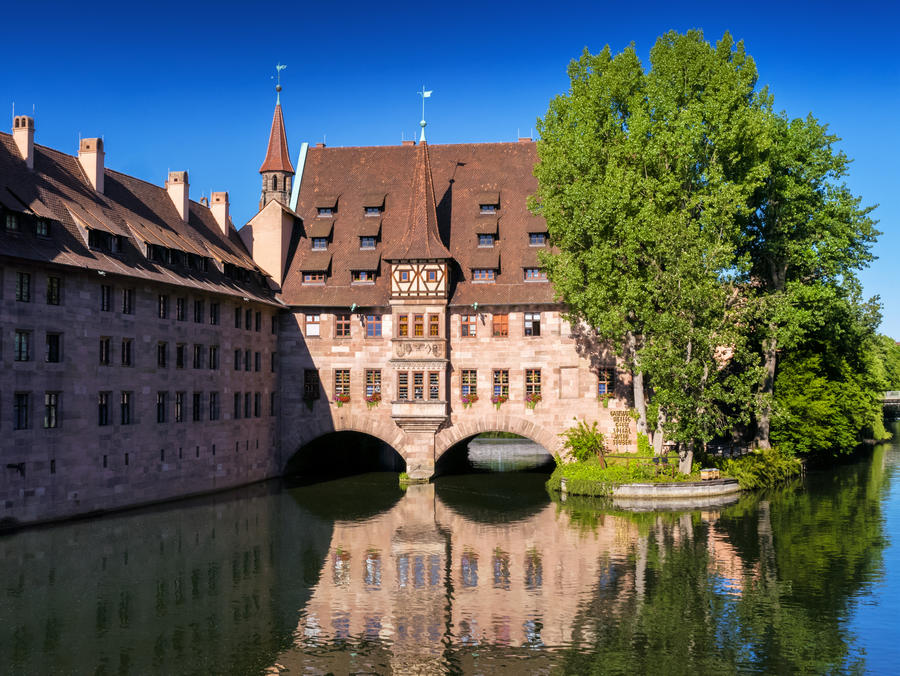 Beautiful mountain landscape in the Bavarian Alps with pilgrimage church of Maria Gern and Watzmann massif in the background, Nationalpark Berchtesgadener Land, Bavaria, Germany
