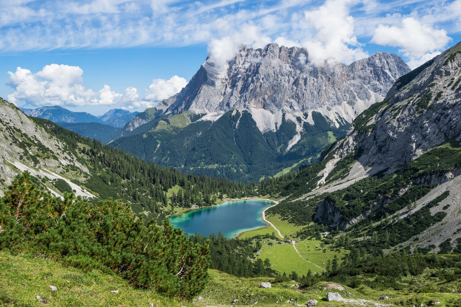 Mt. Zugspitze (highest mountain of Germany) with mountain lake in foreground.