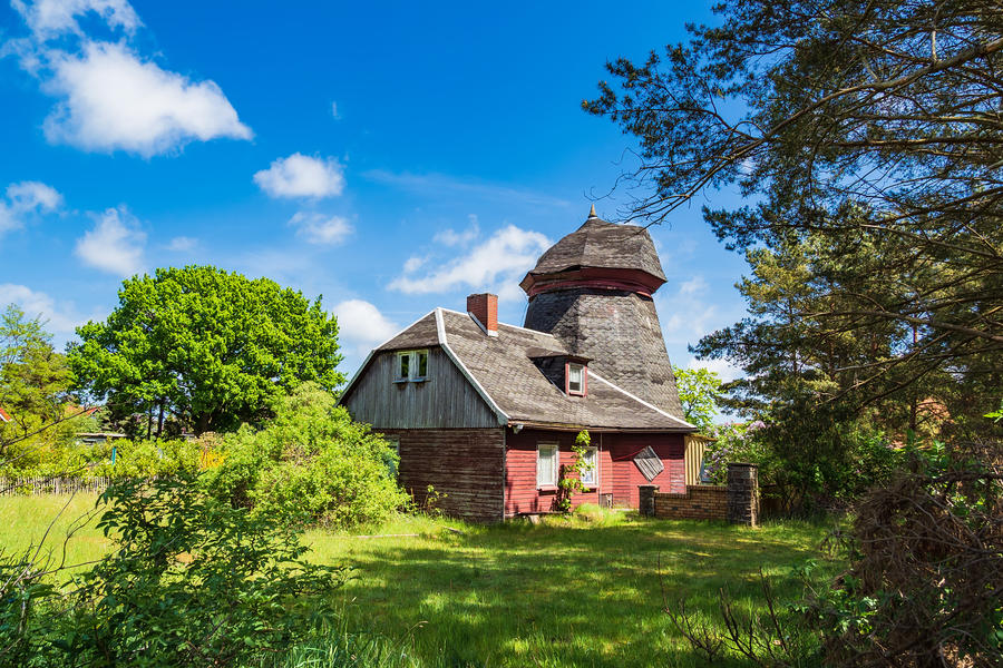 Old wind mill with trees in Wiek, Germany.