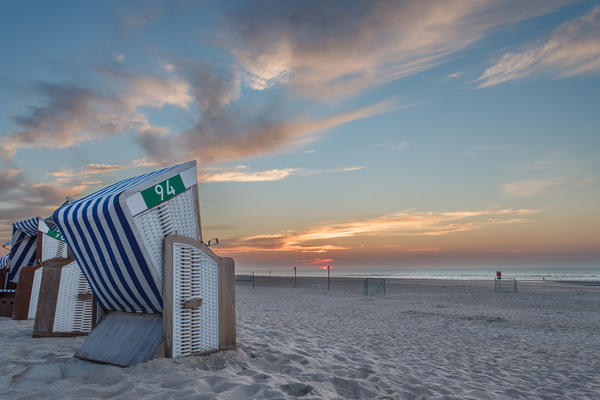 Beach chair in the sunset on the island of Norderney in the Germ