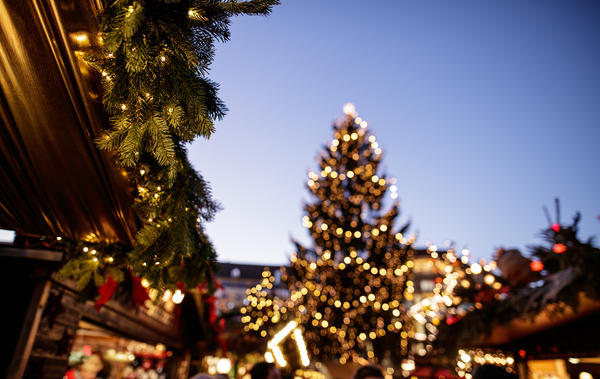 European Christmas Market Scene. Dresden, Germany. Beautiful Sparkling and Twinkling Christmas City Lights on a Fair. Winter Holiday Season background. Travel Europe Concept