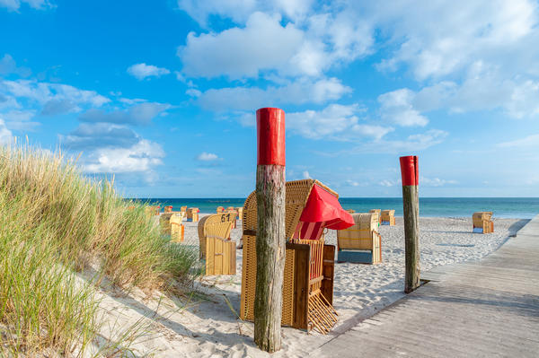 Roofed wicker beach chair at the South beach in Burgtiefe at the Baltic Sea