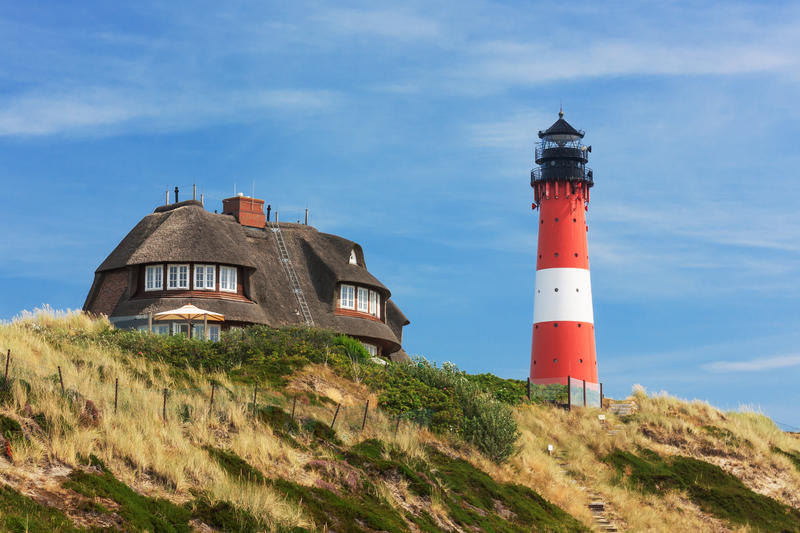Lighthouse Hörnum on Sylt at the North Sea, Schleswig-Holstein, Germany with dunes.
