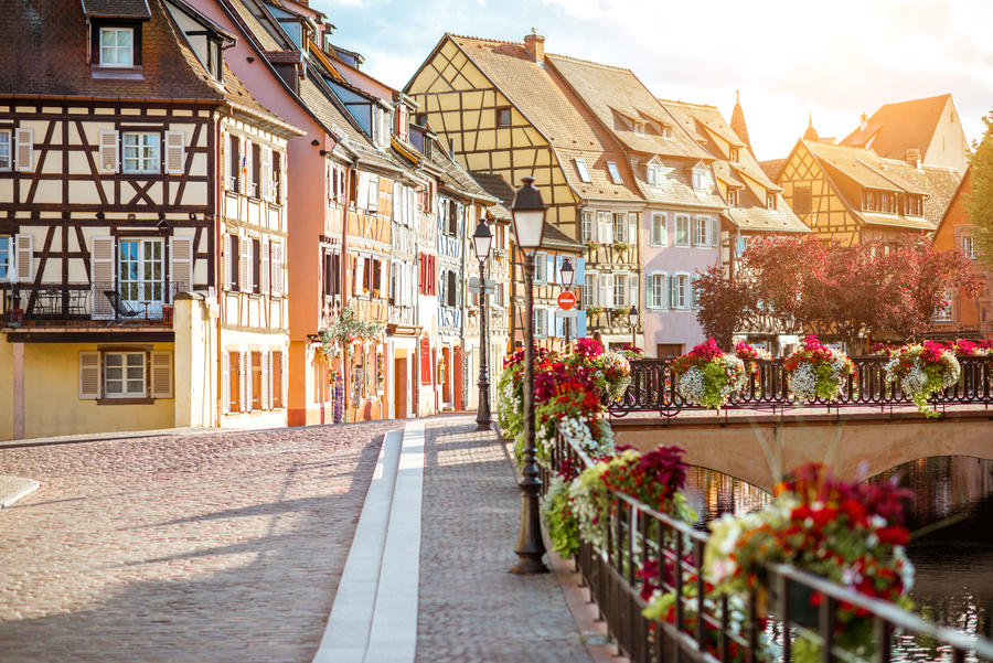 Landscape view on the beautiful colorful buildings on the water channel in the famous tourist town Colmar in Alsace region, France