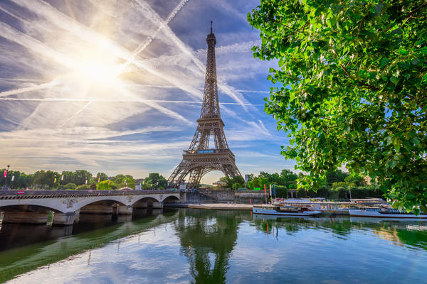 Paris Eiffel Tower and river Seine in Paris, France. Eiffel Tower is one of the most iconic landmarks of Paris.