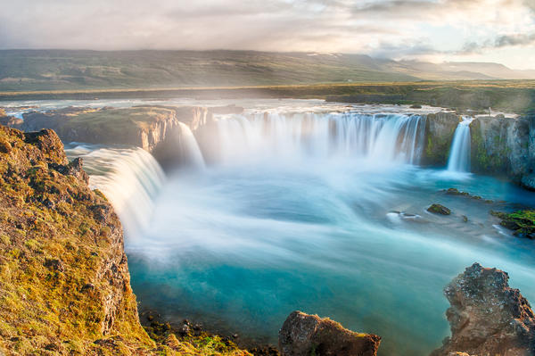 Godafoss is a very beautiful Icelandic waterfall. It is located on the North of the island not far from the lake Myvatn and the Ring Road. This photo is taken after the midnight sunset