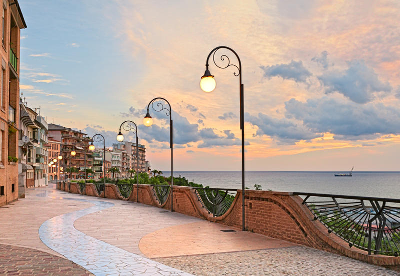 seafront at dawn in Ortona, Abruzzo, Italy - beautiful terrace with street lamp on the Adriatic sea  