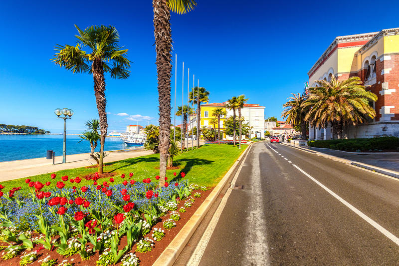Street near the harbor in the city of Porec town on Adriatic sea in Croatia, Europe.