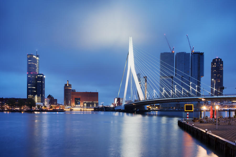 City of Rotterdam downtown skyline by the river at night in South Holland, the Netherlands.