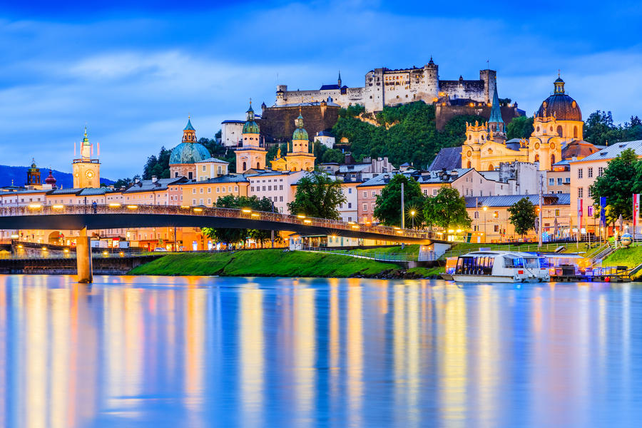 Salzburg, Austria. Festung Hohensalzburg fortress, Salzburger Dom and Salzach river at twilight.