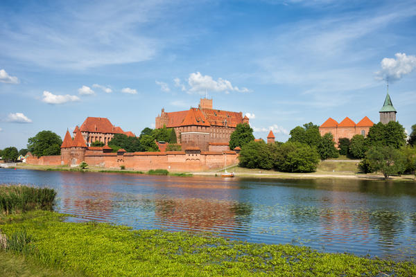 Malbork Castle and Nogat River in Poland, medieval landmark fortress of the Teutonic Knights Order