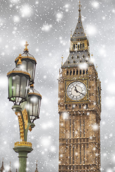 Big Ben on a winter snowy day against cloudy sky