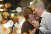 Romantic senior couple dancing together at dance hall