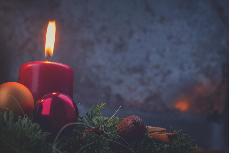 Evergreen fir tree advent garland with one candles on wooden background, retro toned