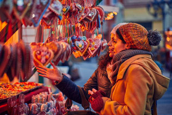 Friends Buying Candies On Christmas Market