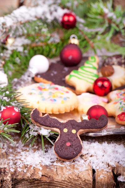 christmas cookies with red and white christmas balls and snow